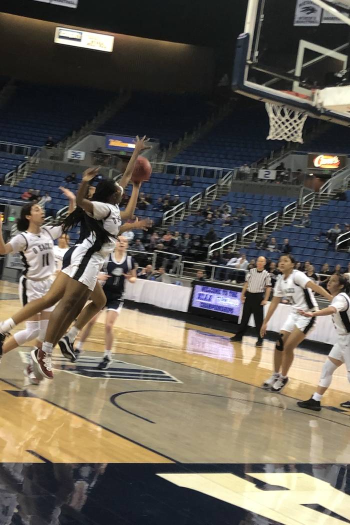 Desert Oasis senior forward Desi-Rae Young blocks a shot during the first quarter of the Class ...