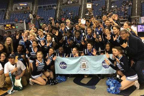Centennial's girls basketball team poses with the school's band and cheerleaders after a 79-51 ...