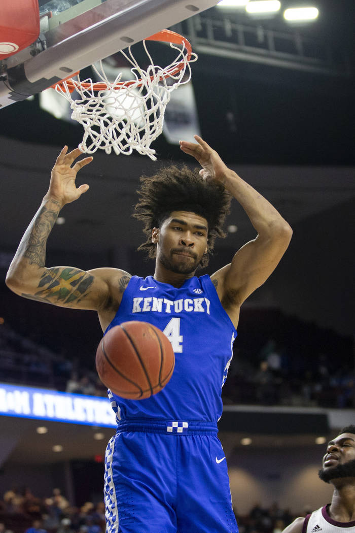 Kentucky forward Nick Richards (4) dunks over Texas A&M forward Josh Nebo (32) during the f ...