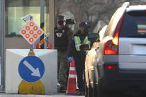 In this Thursday, Feb. 20, 2020 photo, a U.S. military policeman and South Korean security pers ...