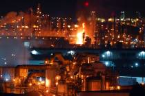 A fire burns after an explosion at the Marathon Refinery in Carson, California, on Tuesday, Fe ...