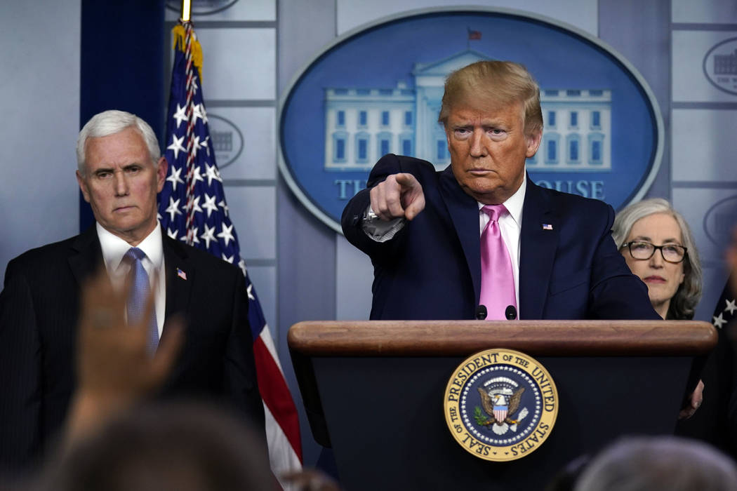 President Donald Trump, with members of the president's coronavirus task force, speaks during a ...