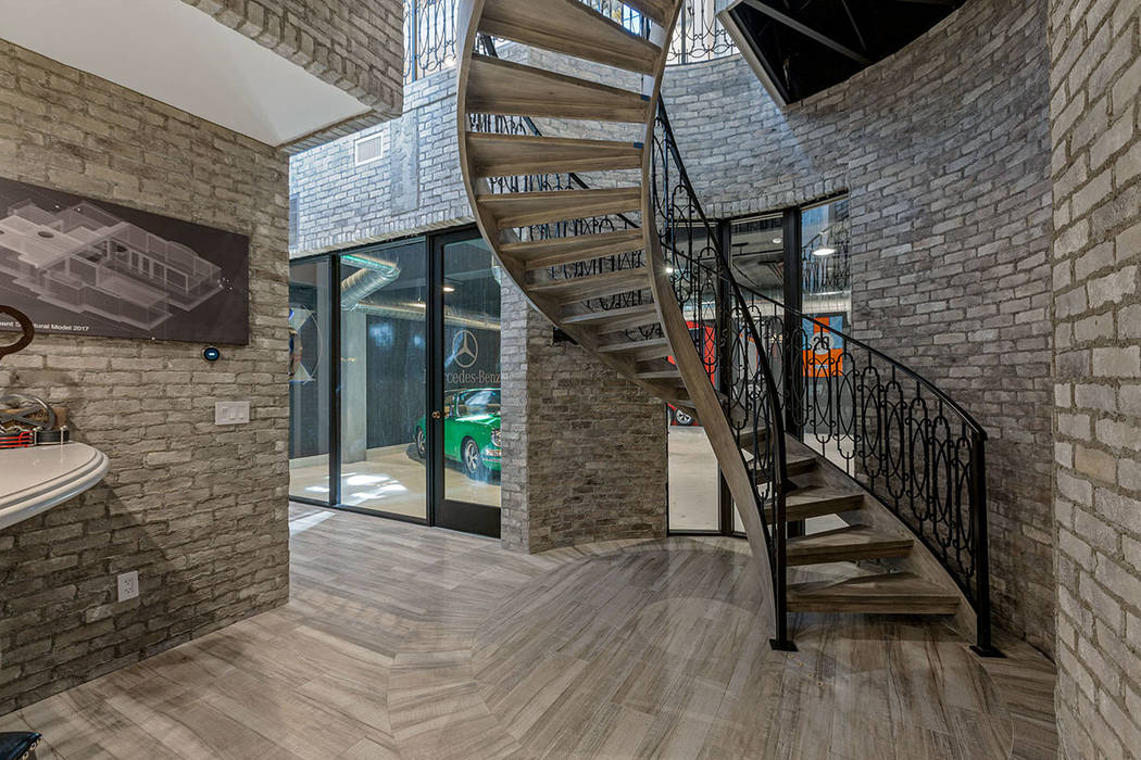 The custom staircase leads to the unique garage. (Ivan Sher Group)