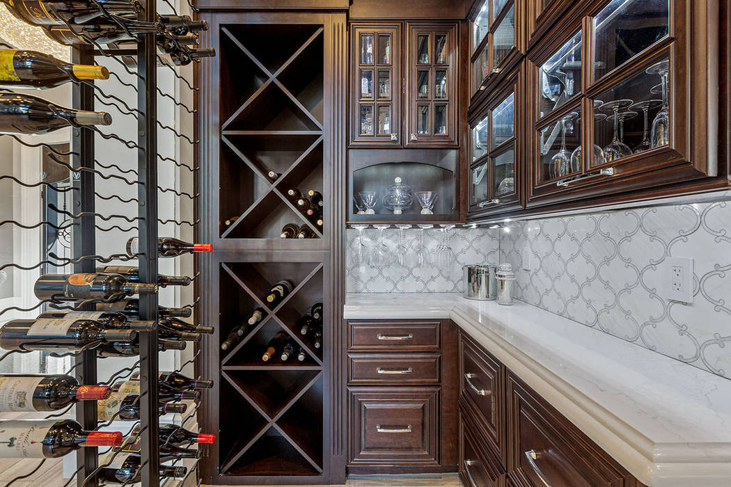 For wine enthusiasts, a wine cellar off the main entry can store 800-plus bottles. (Ivan Sher G ...