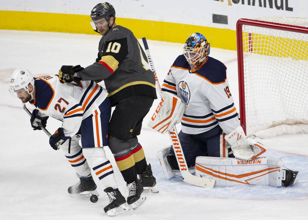 Edmonton Oilers defenseman Mike Green (27) blocks the shot of Vegas Golden Knights center Nicol ...