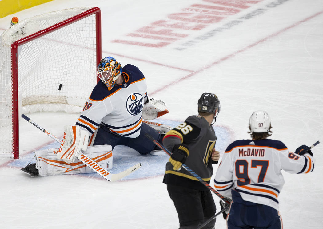 Golden Knights center Paul Stastny (26) watches a shot from Vegas Golden Knights defenseman She ...