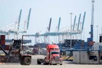 In this Friday, Feb. 14, 2020 photo, a truck leaves the docks at PortMiami in Miami. On Thursda ...