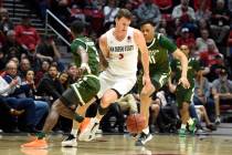 San Diego State forward Yanni Wetzell (5) steals the ball from Colorado State guard Kendle Moor ...