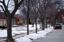 Police are seen outside of a house near Potomac and Courtland after a shooting at Molson Coors, ...