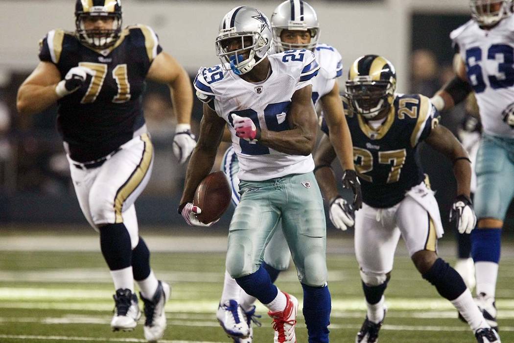 Dallas Cowboys running back DeMarco Murray (29) runs from St. Louis Rams defensive tackle Gary ...