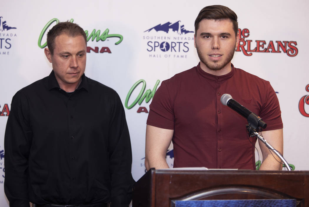 Kelan Gondrezick, left, and Travis Gondrezick, right, thank the Southern Nevada Sports Hall of ...