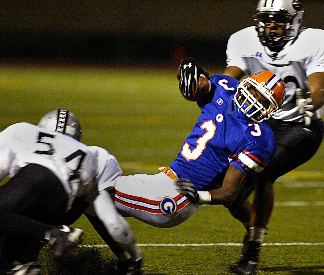 DeMarco Murray is tackled during his high school career at Bishop Gorman. (Review-Journal file ...