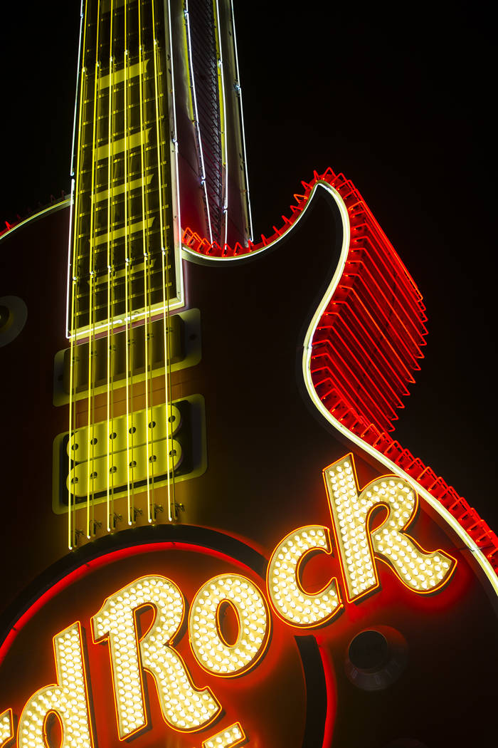 The Hard Rock Cafe guitar sign is illuminated for the first time in public during a special eve ...