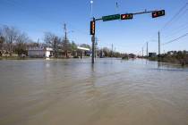 High water from a water main break floods Clinton Drive just east of the East Loop 610 on Thurs ...