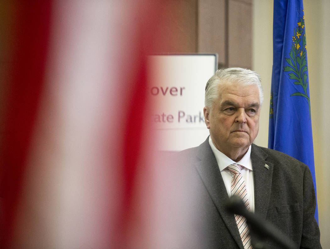 Gov. Steve Sisolak listens to a speaker during a press conference to update the public on the s ...