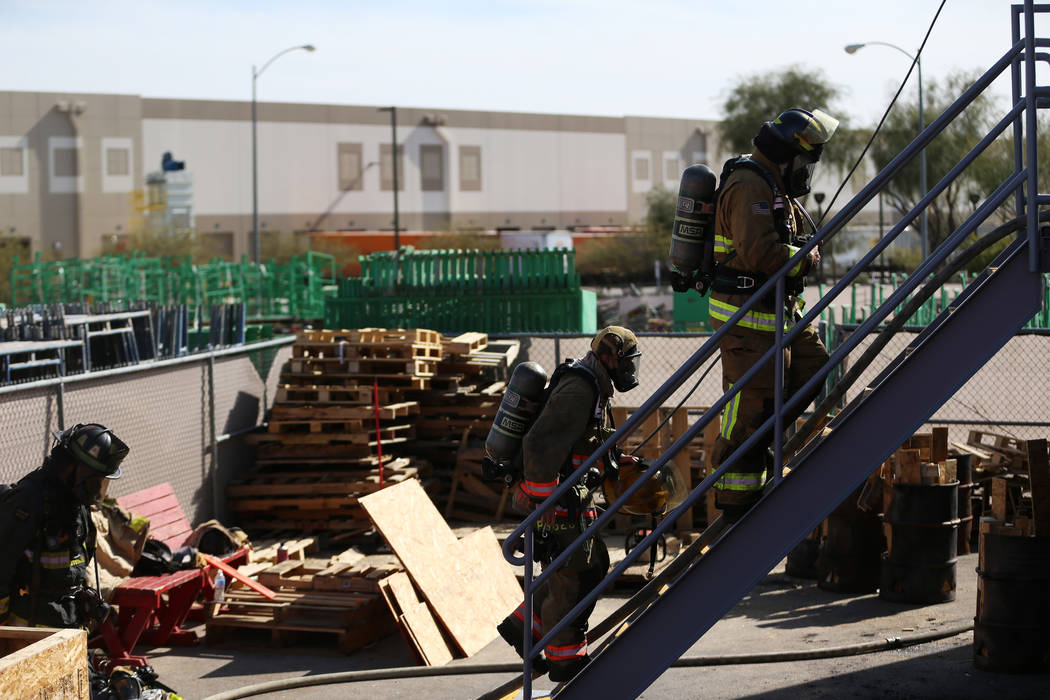 Multiagency firefighters participate during a live fire training at Fire Station 52 in North La ...