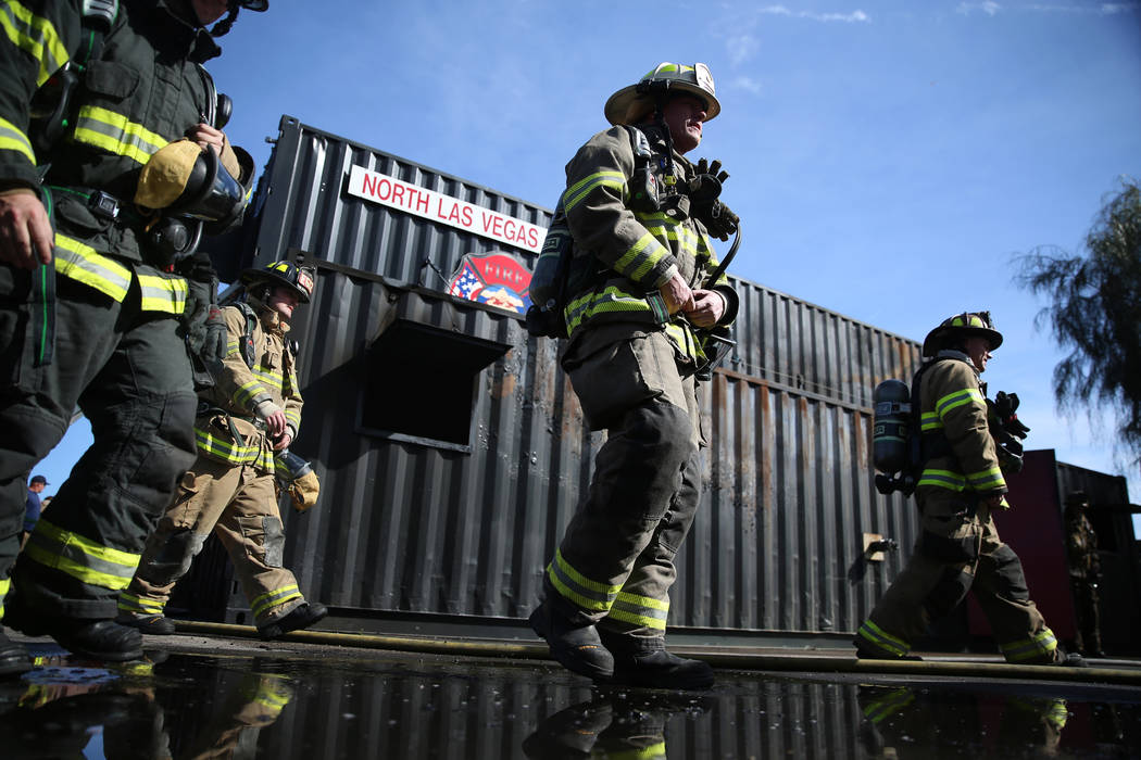 Cameron Siplon, center, deputy chief for the Casper Fire-EMS Department in Casper, Wyo., partic ...