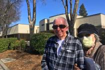 Eugenia Kendall, right, wears a mask outside of the Vacaville City Hall while standing with her ...