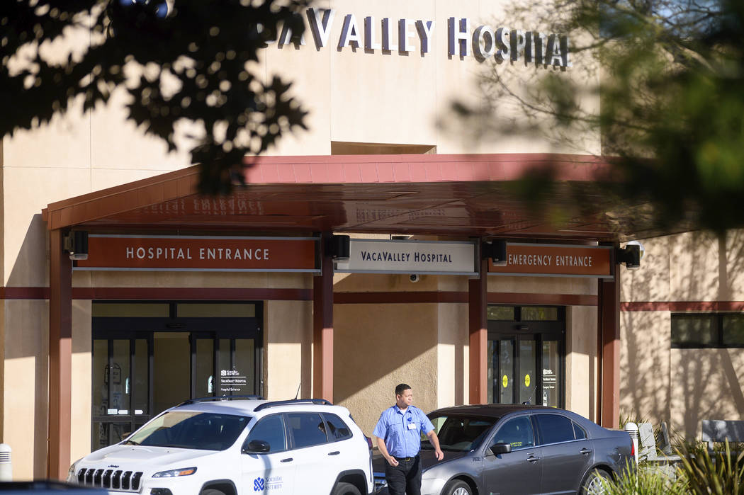 A security guard leaves NorthBay VacaValley Hospital, where a woman diagnosed with coronavirus ...