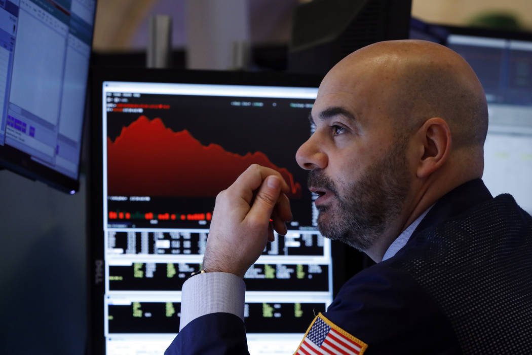 Trader Fred DeMarco works on the floor of the New York Stock Exchange, Friday, Feb. 28, 2020. G ...