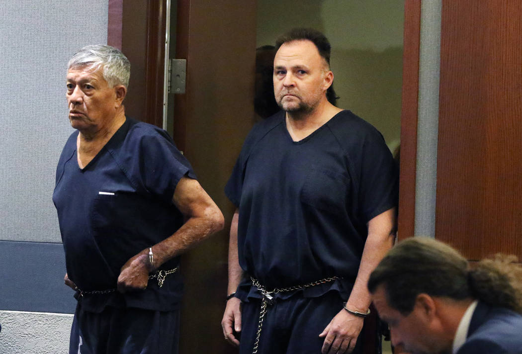 Former Las Vegas police officer Christopher Peto, 47, right, enters the courtroom during his co ...
