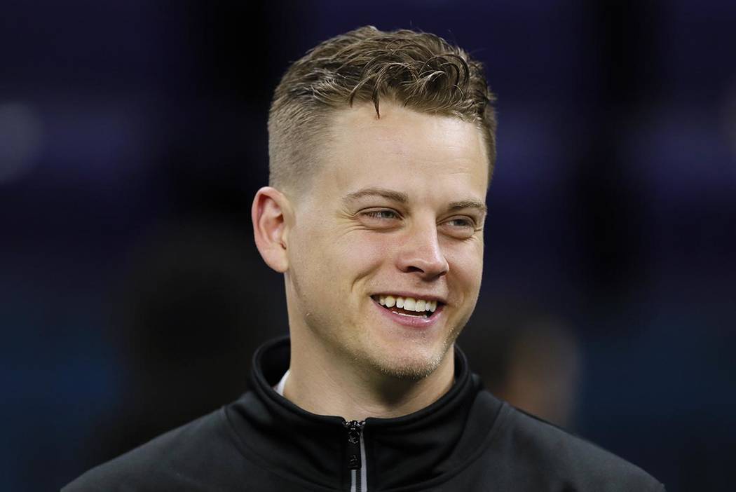 LSU quarterback Joe Burrow watches a drill at the NFL football scouting combine in Indianapolis ...