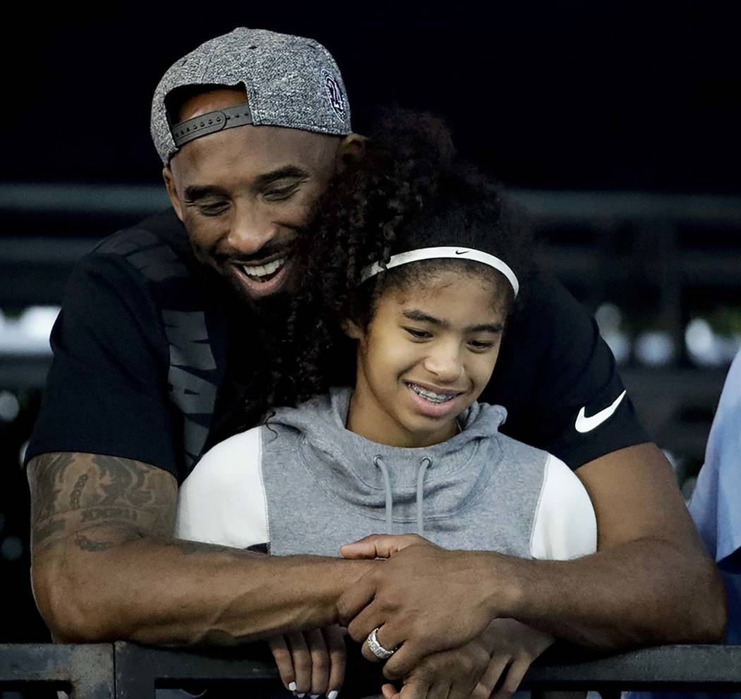 In this July 26, 2018, file photo former Los Angeles Laker Kobe Bryant and his daughter Gianna ...