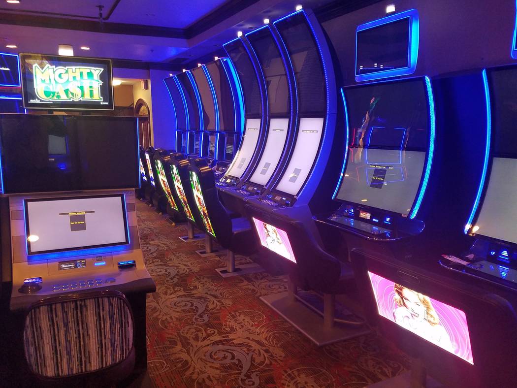 Slot machines at Binion's show "out of service" messages on Friday, Feb. 28, 2020. (Richard N. ...