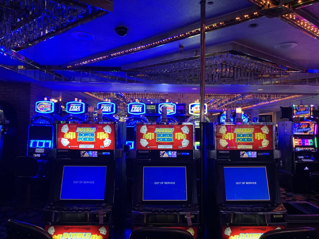 Slot machines at Four Queens show "out of order" messages on Friday, Feb. 28, 2020. ( ...