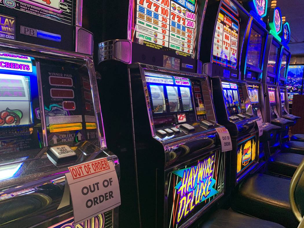 Slot machines at Four Queens show "out of order" messages on Friday, Feb. 28, 2020. ( ...