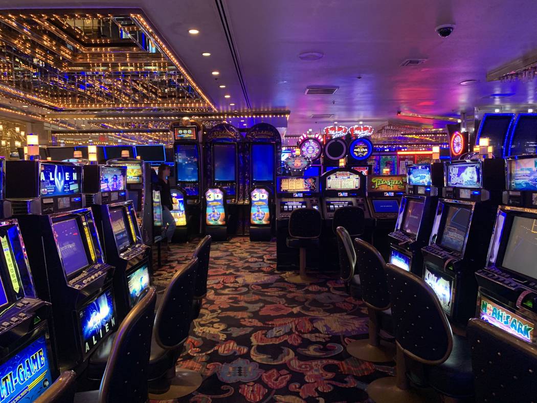 Slot machines at Four Queens show "out of order" messages on Friday, Feb. 28, 2020. ( ...