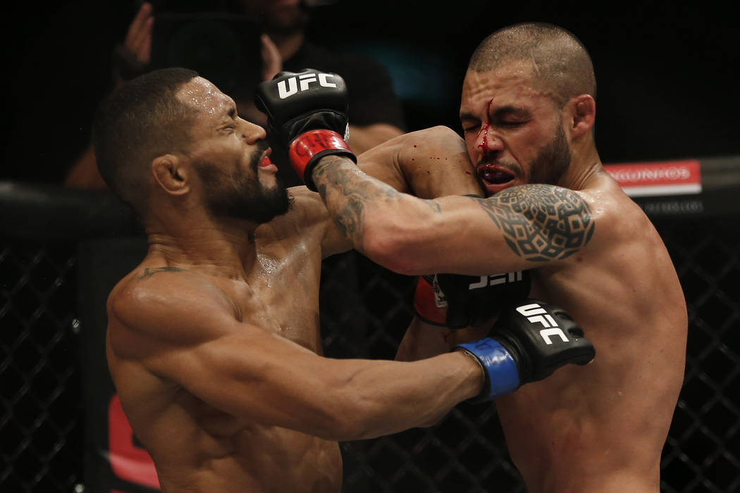 Deiveson Figueiredo, left, of Brazil, fights Marco Beltran of Mexico during their UFC bantamwei ...