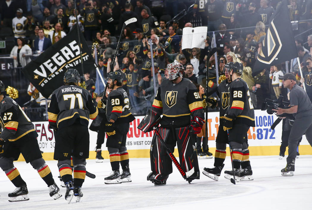 Golden Knights goaltender Robin Lehner (90) celebrates with his teammates after an NHL hockey g ...