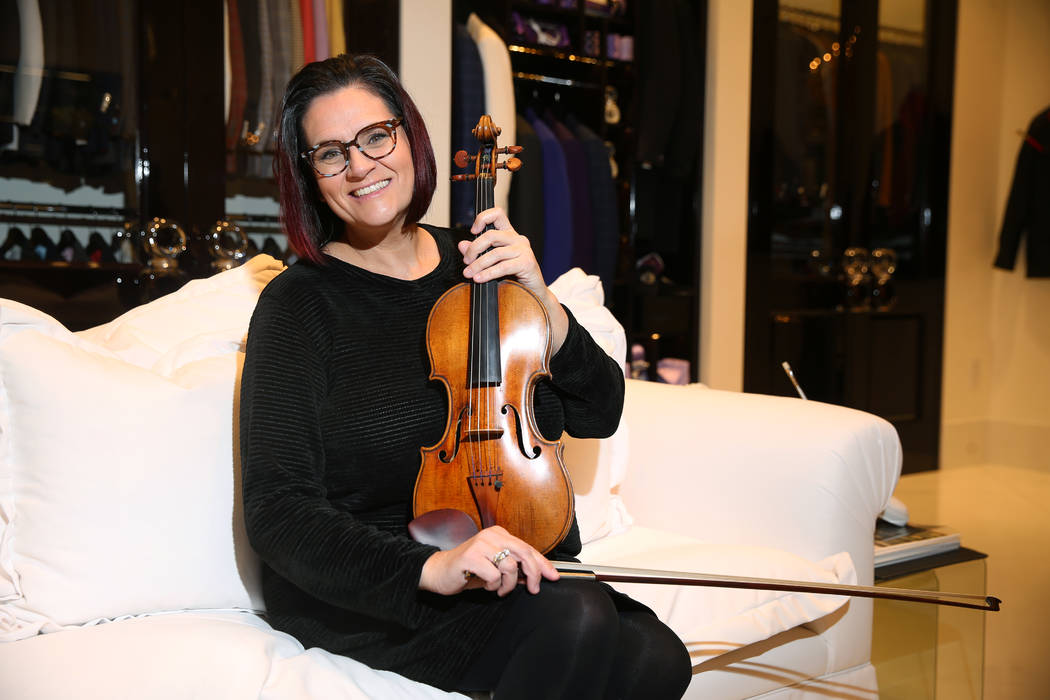 Las Vegas Philharmonic concertmaster De Ann Letourneau holds a 300-year-old Stradivarius violin ...