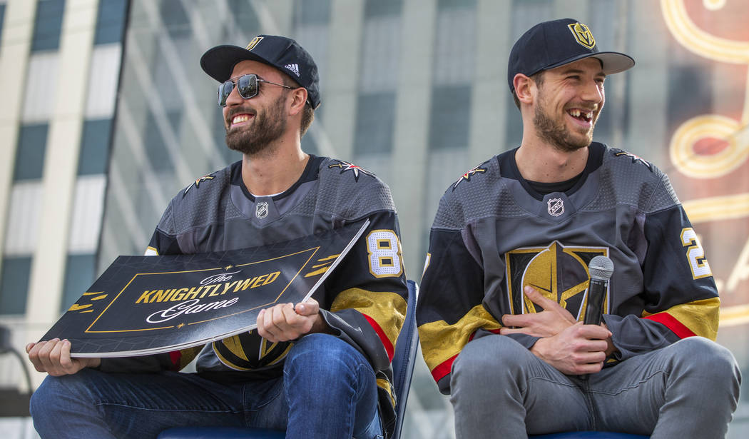 Vegas Golden Knights players Alex Tuch, left, and Shea Theodore laugh as they play a round of T ...