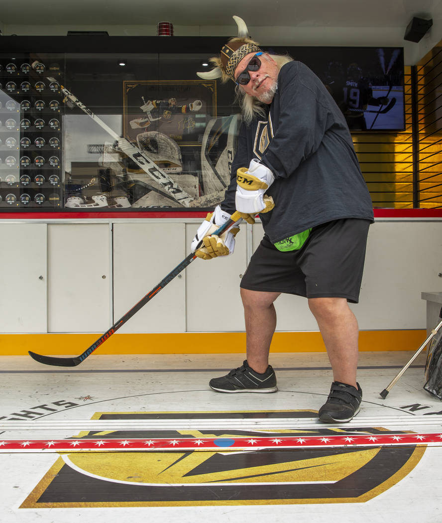 Super fan Robert Gray poses as a hockey player during the Vegas Golden Knights Fan Fest at the ...