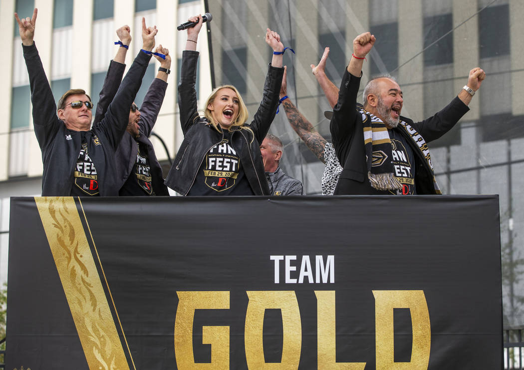 Team Gold celebrates their second round win during a game of Knight Family Feud on stage during ...