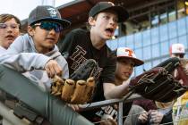 Fans wait after the game for autographs at the conclusion of the Cleveland Indians and Oakland ...