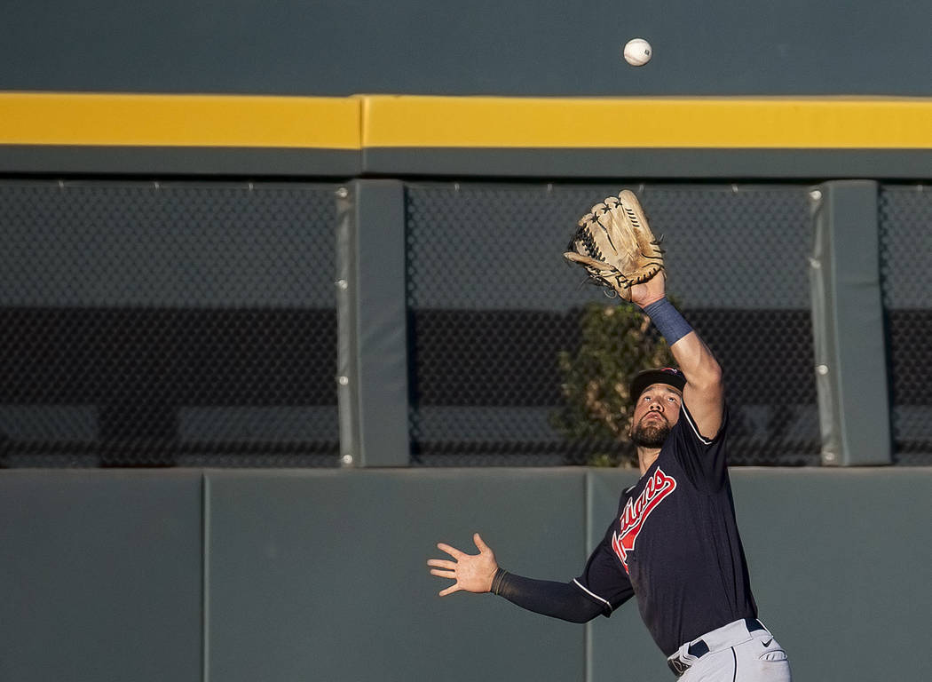Cleveland Indians outfielder Ka'ai Tom (81) makes a leaping catch in the eighth inning during a ...
