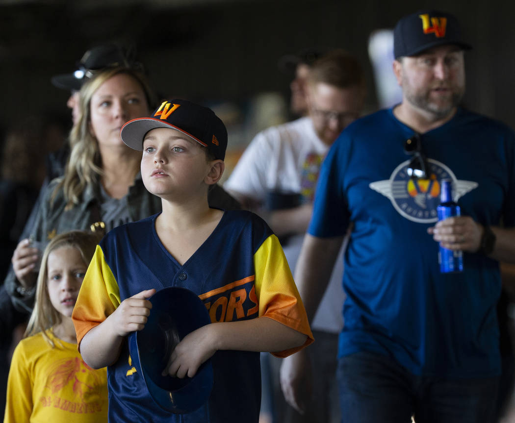 Max Gillian, 9, walks to his seat during a Major League Baseball game between the Cleveland Ind ...