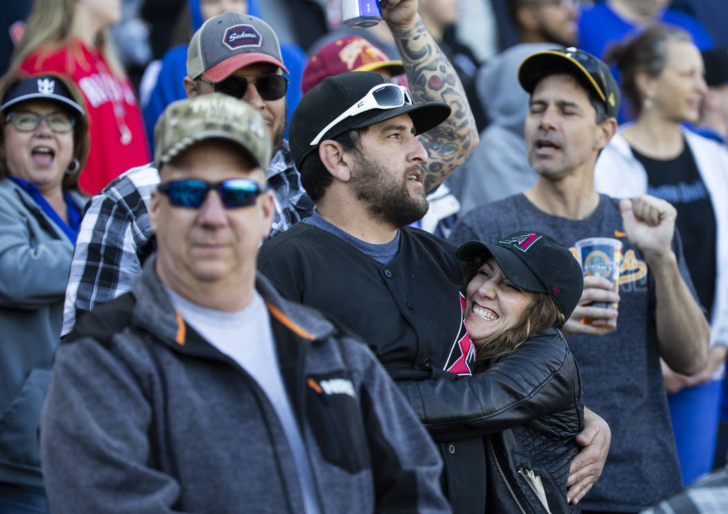 Fans sing "Take Me Out to the Ball Game" during the seventh inning stretch of a Major ...
