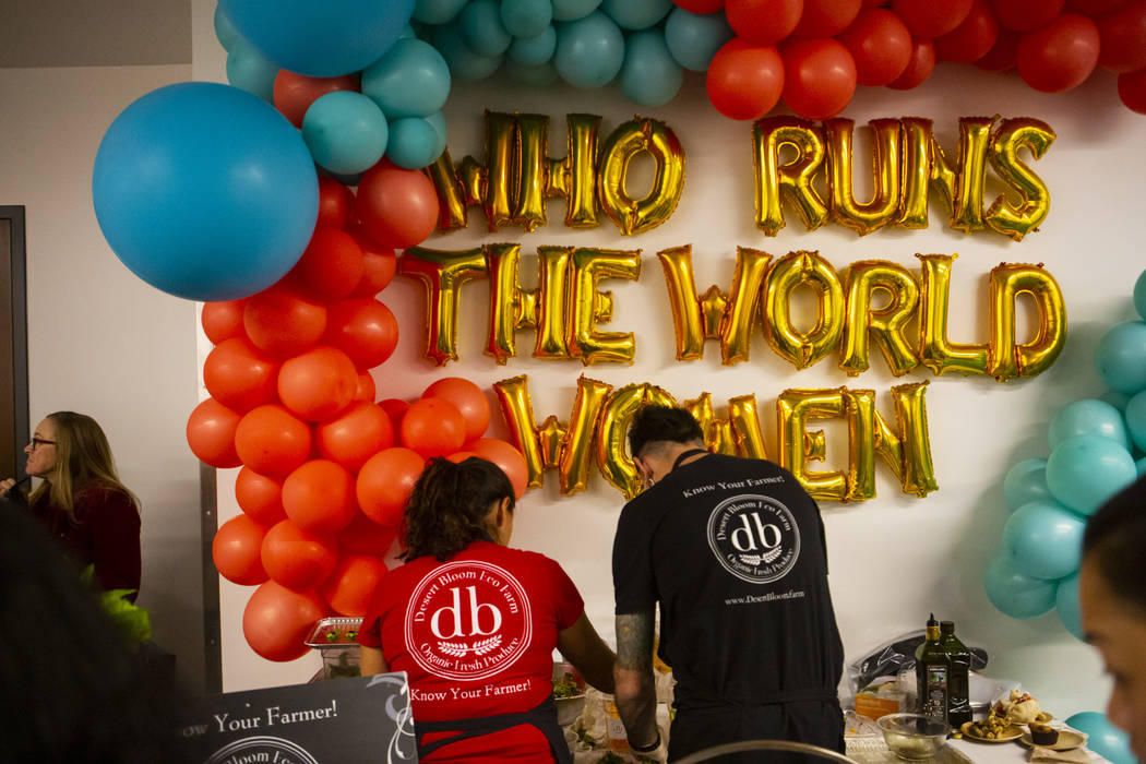 Claudia Andracki, owner of Desert Bloom Eco Farm, left, prepares food during the culinary celeb ...