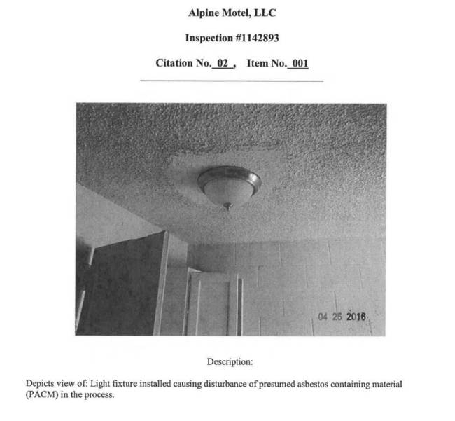 A photo from a Nevada OSHA report that depicts a light fixture installed in the Alpine Motel Ap ...