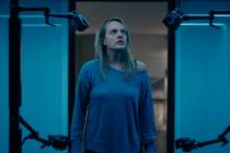 This image released by Universal Pictures shows Elisabeth Moss in a scene from "The Invisi ...
