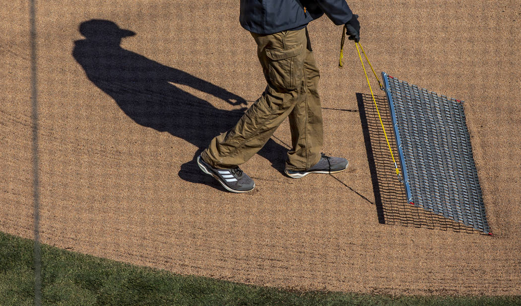 The home plate area is smoothed out as the Cleveland Indians and Oakland Athletics ready to pla ...