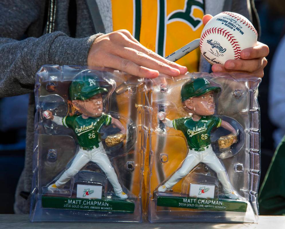 A young fan waits for an autograph from an Oakland Athletics player during a Big League Weekend ...