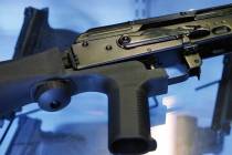 In a Oct. 4, 2017, file photo, a "bump stock" is attached to a semi-automatic rifle at the Gun ...