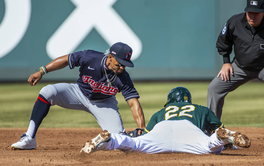 Cleveland Indians infielder Francisco Lindor (12) tags out Oakland Athletics runner Ramon Laur ...