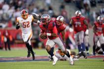 Houston Roughnecks quarterback P.J. Walker (11) carries the ball as he runs during an XFL footb ...