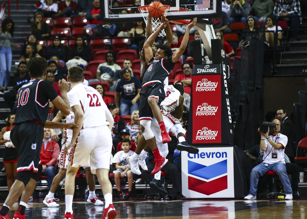 UNLV's Bryce Hamilton (13) gets the rebound against Fresno State's Niven Hart (4) during the fi ...